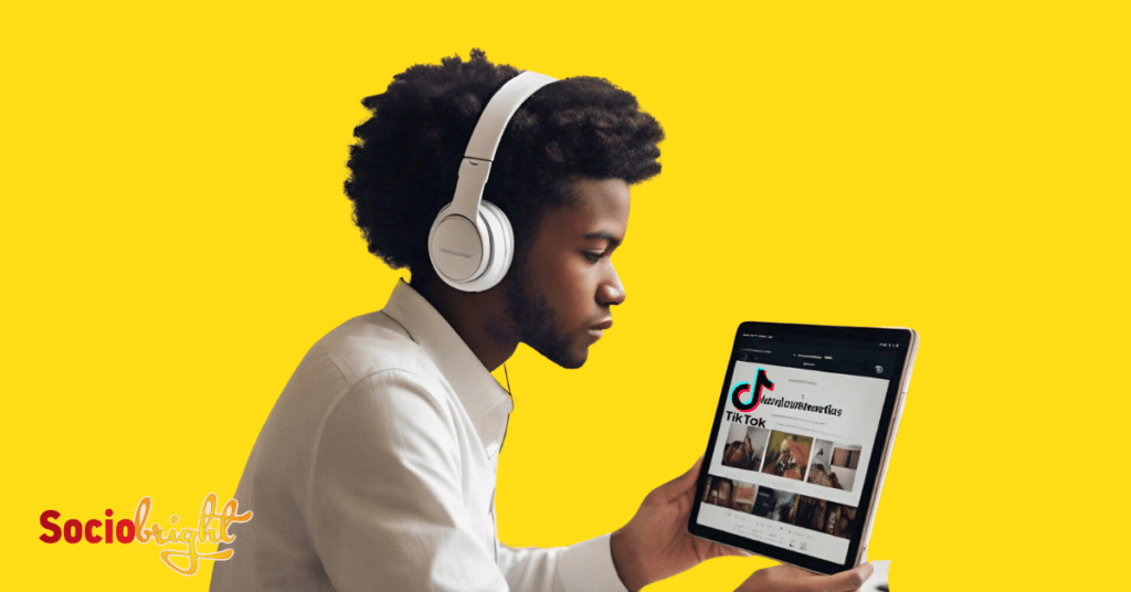 a young entrepreneur wearing headphones and watching educational TikTok videos on a tablet about advertising.